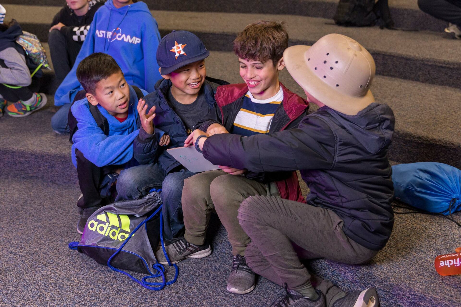 Four boys laughing.