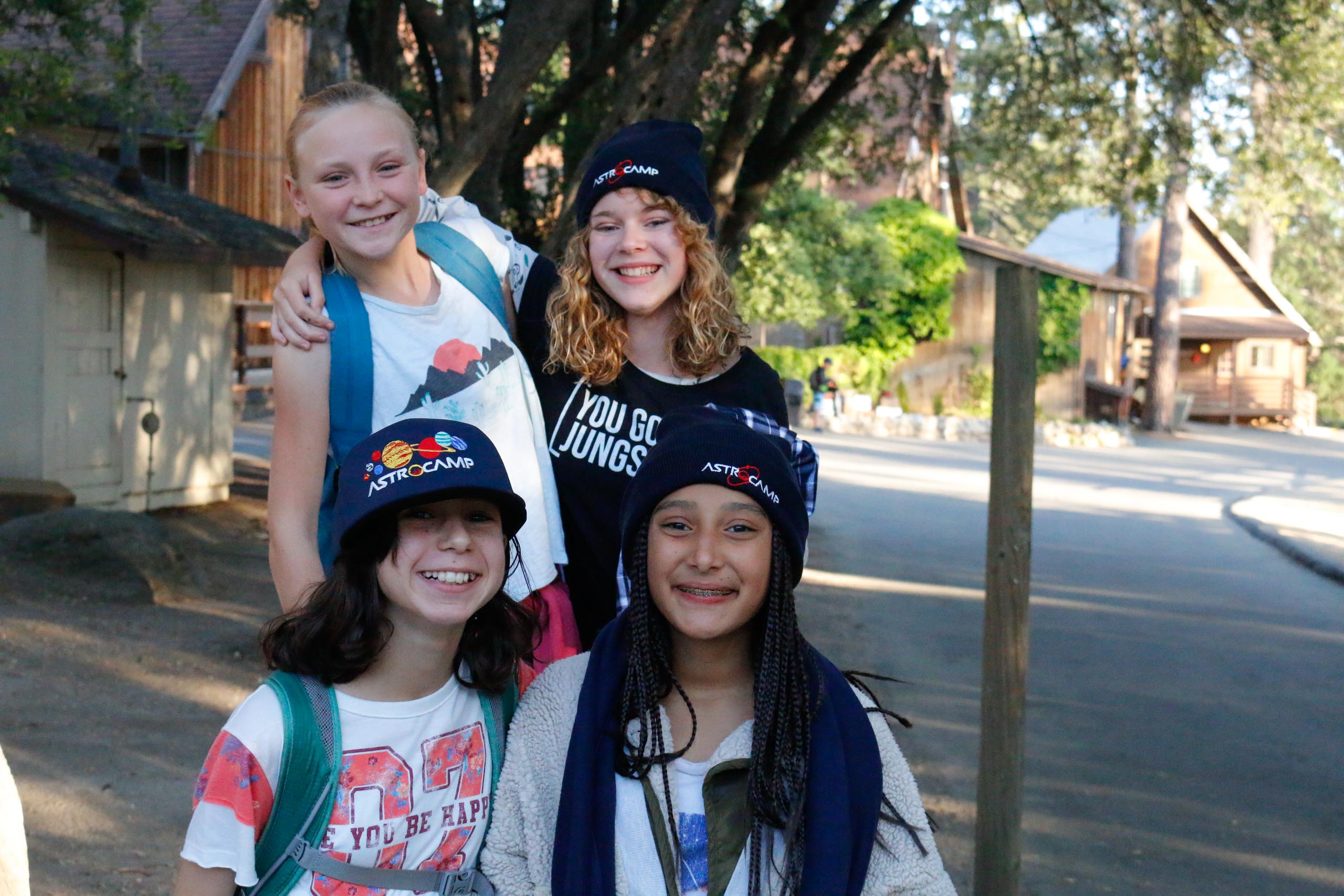 Four girls smiling.