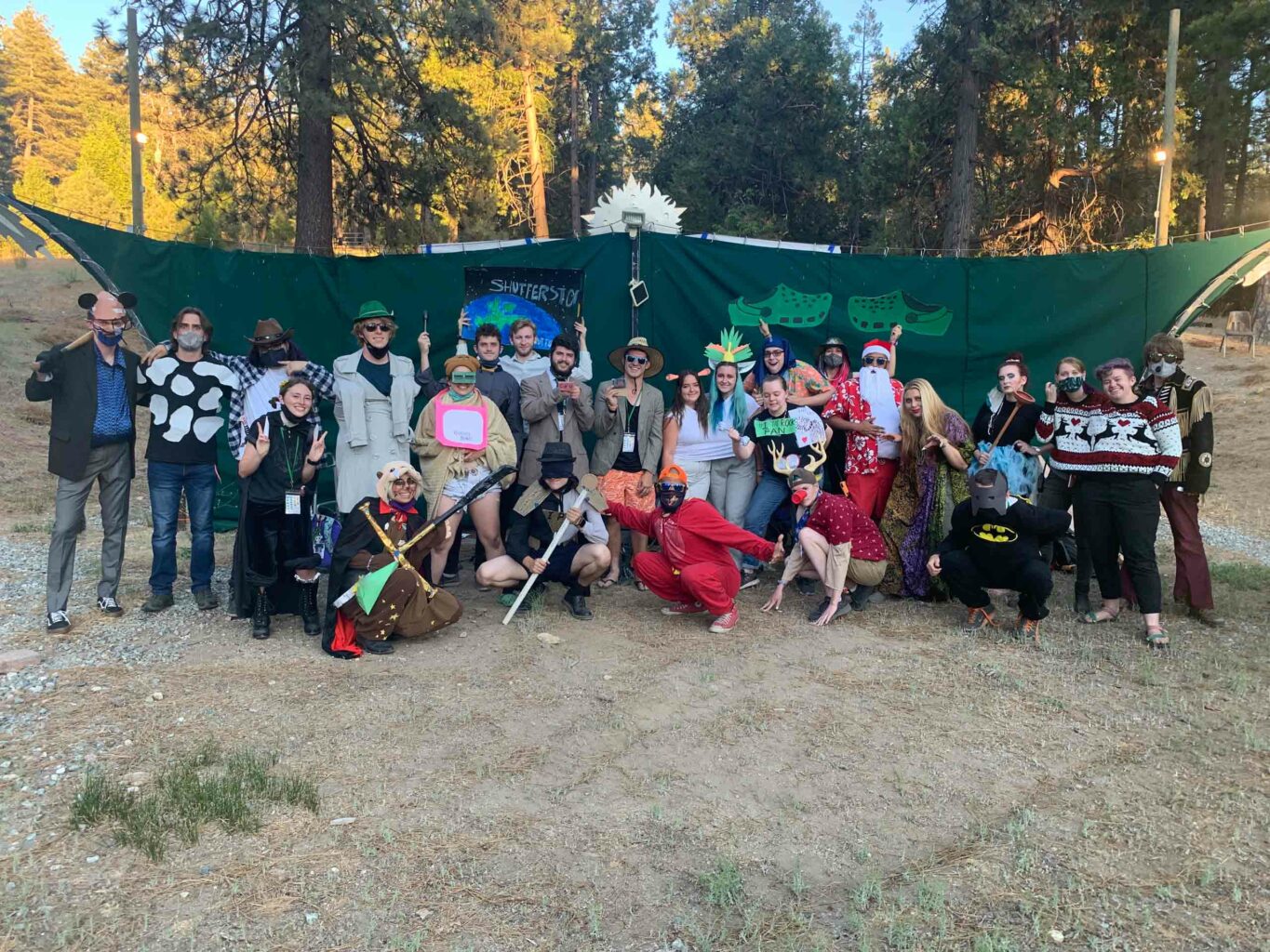 Group of people posing in costumes.