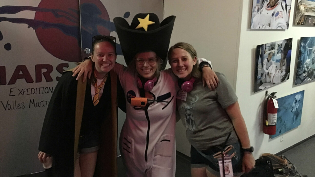 Staff posing in costumes.