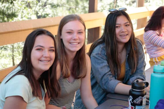 Three girls smiling.