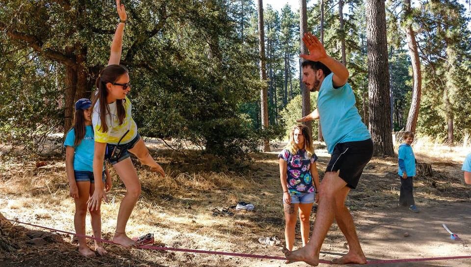 Two people on tightrope.